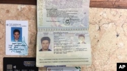 FILE - In this photo released by the Egyptian Ministry of Interior on Thursday, March 24, 2016, personal belongings of slain Italian graduate student Giulio Regeni, including his passport, are displayed.