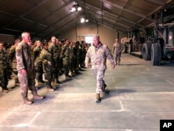 FILE - Marine Gen. Frank McKenzie meets with troops at Prince Sultan Air Base in Saudi Arabia, Jan. 29, 2019.