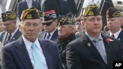 U.S. veterans, who fought in foreign wars, attend a U.S. Veteran's Day Ceremony at Yongsan Garrison, the main U.S. military headquarters in Seoul, South Korea, Tuesday, Nov. 11, 2014.