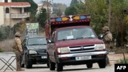 Lebanese army soldiers man a checkpoint in southern Lebanon's Marjayoun area after a ceasefire between Israel and Hezbollah took effect on Nov. 27, 2024.