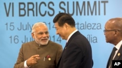 Narendra Modi (Inde), Xi Jinping (Chine) et Jacob Zuma (Afrique du Sud), Fortaleza, Brésil, le 15 juillet 2014. (AP Photo/Silvia Izquierdo)