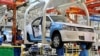 FILE - Employees work on assembling vehicles at a plant of SAIC Volkswagen in Urumqi, Xinjiang Uighur Autonomous Region, China September 4, 2018. (China Daily via REUTERS)