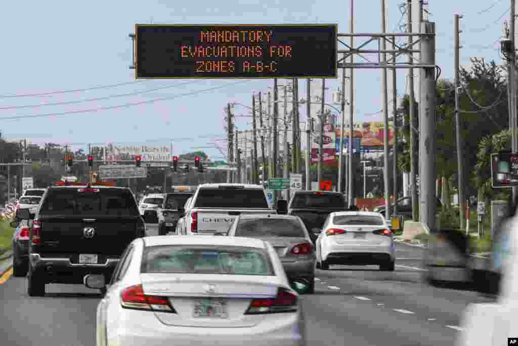 Highway signage announces the impending arrival of Hurricane Milton and the evacuations zones, Oct. 8, 2024, in Port Richey, Florida.