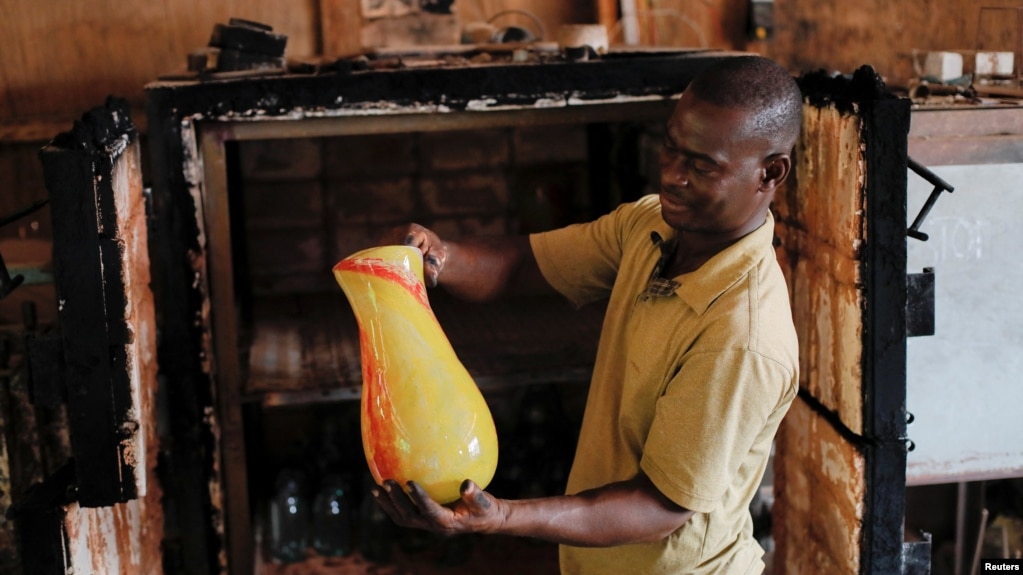 Ghana's only glassblower Michael Tetteh produces glassware at his glassware manufacturing workshop, in Krobo Odumase.
Picture taken March 18, 2022. (REUTERS/Francis Kokoroko)