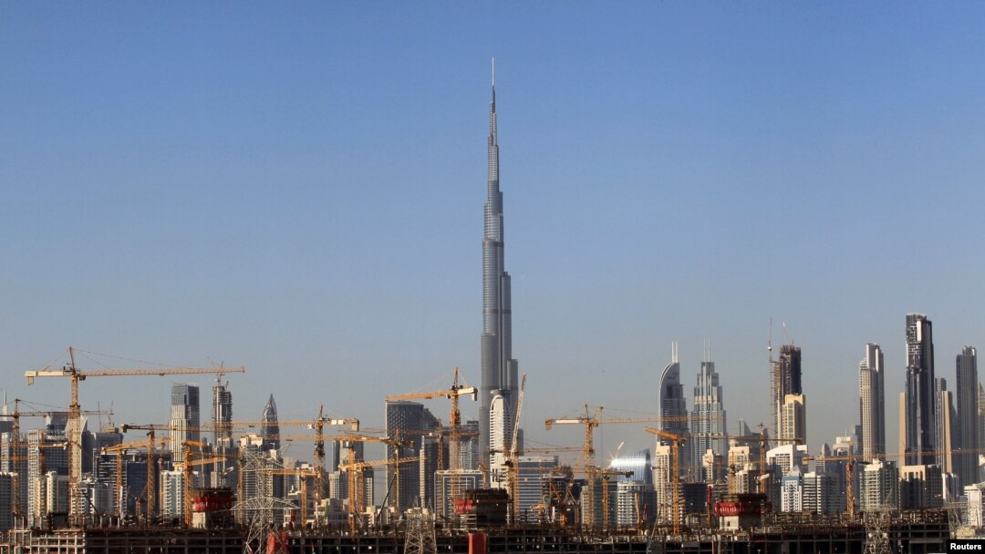 FILE - General view of Dubai's cranes at a construction site in Dubai, UAE, Dec. 18, 2018.