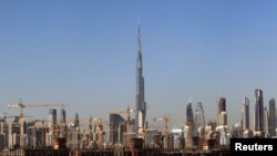 FILE - General view of Dubai's cranes at a construction site in Dubai, UAE, Dec. 18, 2018.