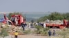 Rescuers and South African Police Service (SAPS) officers carry remains in blue body bags during a recovery operation to retrieve deceased illegal miners from an abandoned gold shaft in Stilfontein, Jan. 13, 2025.