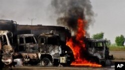 Trucks carrying fuel for NATO forces in Afghanistan burn following an attack by militants in the remote Mitri area, 180 km (112 miles) southeast of Quetta, 09 Oct 2010