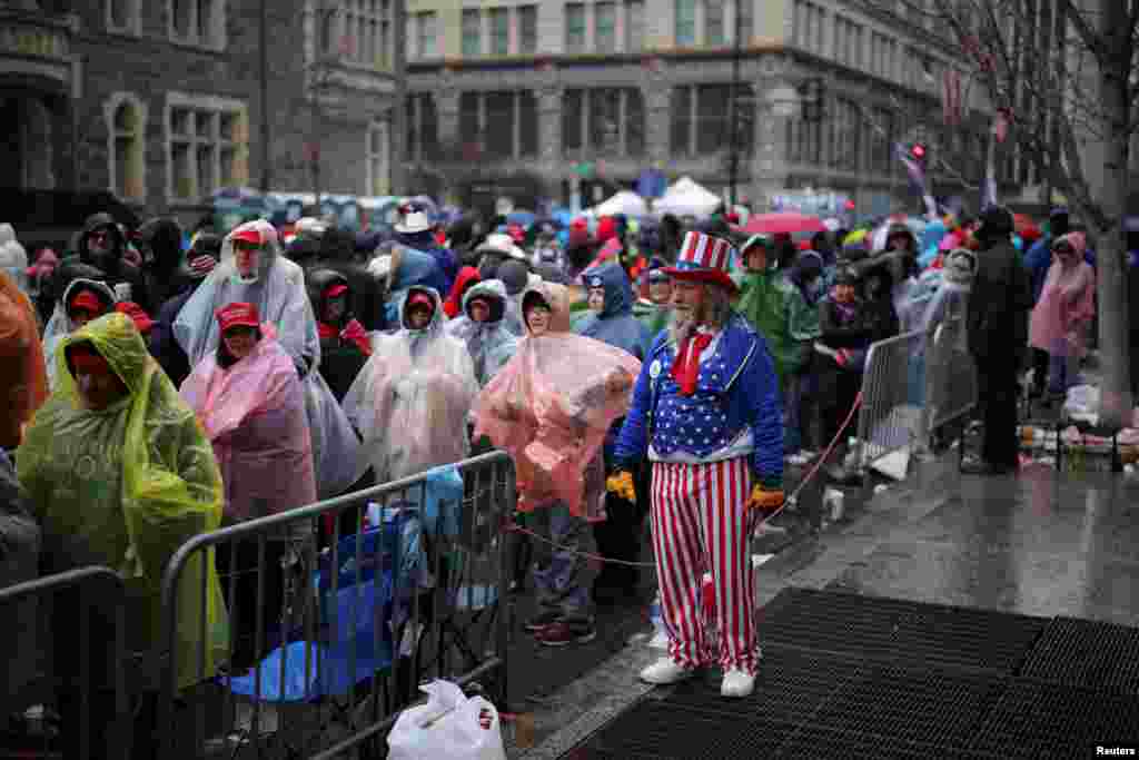 A antheral   dressed arsenic  Uncle Sam looks connected  arsenic  supporters enactment     up   extracurricular  Capital One Arena, up  of a rally for U.S. President-elect Donald Trump the time  earlier  helium  is scheduled to beryllium  inaugurated for a 2nd  term, successful  Washington.