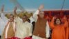 FILE - In this July 28, 2005 photo, President of the Bharatiya Janta Party (BJP) Lal Krishna Advani, second right, senior BJP leaders Uma Bharati, right, Kalyan Singh, second left, and Murli Manohar Joshi wave to people during a public rally in Rae Bareilly. India's top court said April 19, 2017, that the four senior leaders of the BJP Party will stand trial for their role in a criminal conspiracy over the destruction of the 16th century Babri mosque in 1992, an event that sparked bloody nationwide rioting. 