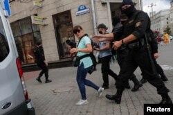 FILE - Law enforcement officers detain journalists in Minsk, Belarus, July 28, 2020. All members of the media were released after being brought to and questioned at a local police station.