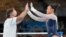 Sunisa Lee, of the United States, greets her coach Jeff Graba after performing on the uneven bars during the artistic gymnastics women's all-around final at the 2020 Summer Olympics, July 29, 2021, in Tokyo.