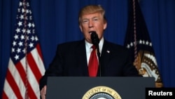 FILE - U.S. President Donald Trump delivers a statement about missile strikes on a Syrian airbase, at his Mar-a-Lago estate in West Palm Beach, Florida.