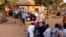 People line up at a polling station to cast their votes in Bissau, Guinea-Bissau, April 13, 2014.