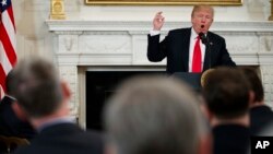 President Donald Trump speaks during a meeting with the members of the National Governors Association in the State Dining Room of the White House, Feb. 26, 2018.