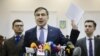 Ukrainian opposition figure and Georgian former President Mikheil Saakashvili, center, addresses the media inside a court building in Kiev, Ukraine, Jan. 3, 2018.