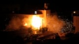 Flames are seen after a blast on the top floor of the family home of an alleged abductor in the West Bank City of Hebron. The bodies of three missing Israeli teenagers were found in the occupied West Bank and Israel vowed to punish Hamas, the Palestinian group it accuses of kidnapping and killing them.