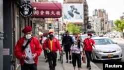 Wally Ng, a member of the Guardian Angels, patrols with other members in Chinatown during the outbreak of the coronavirus disease (COVID-19) in New York City, New York, U.S., May 16, 2020.