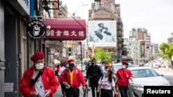 Wally Ng, a member of the Guardian Angels, patrols with other members in Chinatown during the outbreak of the coronavirus disease (COVID-19) in New York City, New York, U.S., May 16, 2020.