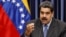 Venezuela's President Nicolas Maduro talks to the media during a news conference at Miraflores Palace in Caracas, Venezuela, Sept. 18, 2018. 