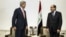 U.S. Secretary of State John Kerry, left, meets with Iraqi Prime Minister Nouri al-Maliki, right, at the Prime Minister's office in Baghdad on Monday, June 23, 2014