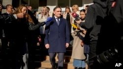 Alexandr Stoianoglo, Moldova's Russia-friendly presidential candidate, leaves a polling station after casting his vote, in Chisinau, Moldova, Nov. 3, 2024, during a presidential election runoff.