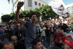 FILE - Algerian students take to the streets to protest the government, in the capital Algiers, Algeria, Oct. 29, 2019.
