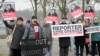 Members of Journalists Without Borders protest against Azerbaijan's President Ilham Aliyev in Berlin, January 21, 2015. 