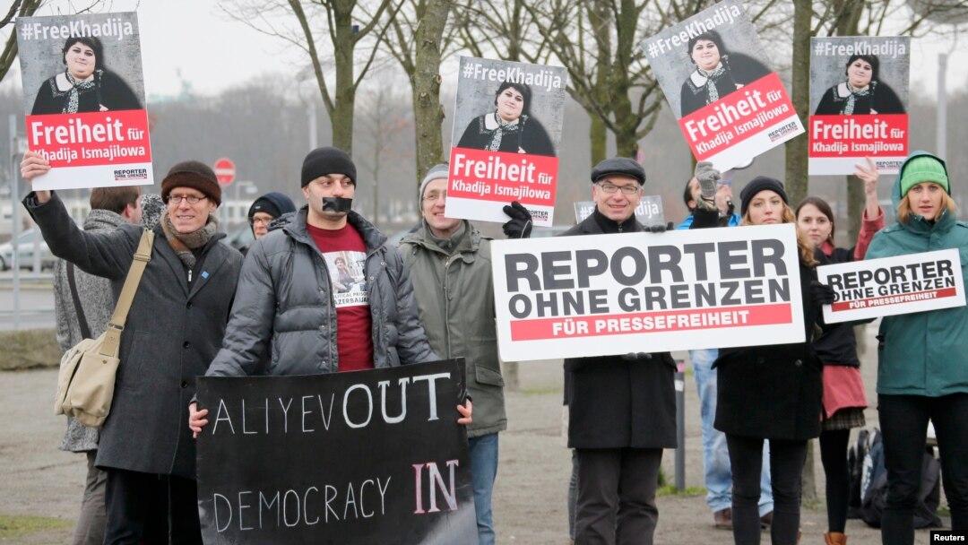 Members of Journalists Without Borders protest against Azerbaijan's President Ilham Aliyev in Berlin, January 21, 2015. 