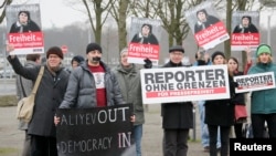 Members of Journalists Without Borders protest against Azerbaijan's President Ilham Aliyev in Berlin, January 21, 2015. 