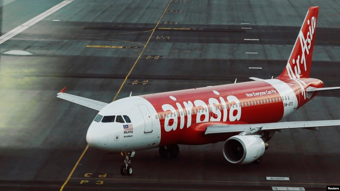 FILE - An AirAsia plane is seen on a runway at Kuala Lumpur International Airport, August 2014.