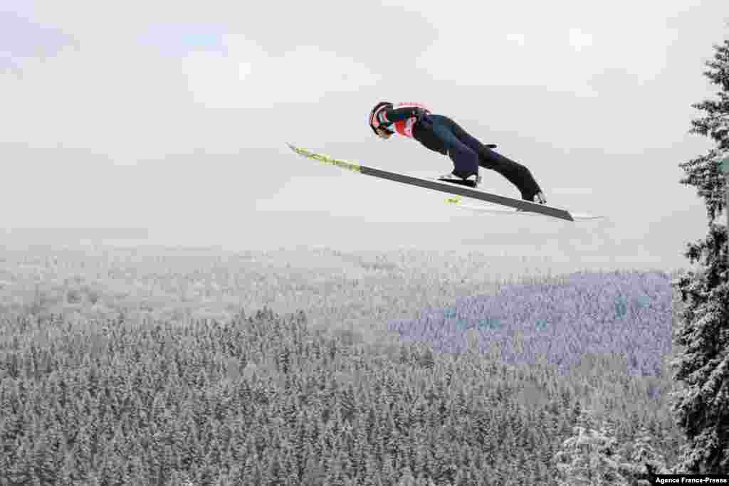 Austria&#39;s Daniel Huber soars through the air during the FIS Men&#39;s Ski Jumping World Cup in Klingenthal, eastern Germany, Dec. 11, 2021.