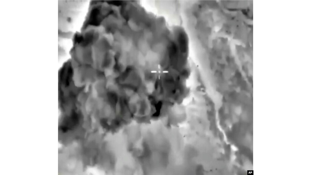 In this photo made from the footage taken from Russian Defense Ministry official web site on Oct. 3, 2015 a bomb explosion is seen in Syria.
