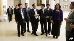 FILE PHOTO - Cambodia's opposition Cambodia National Rescue Party (CNRP) lawmaker members talk during a lunch break inside the National Assembly in Phnom Penh, Cambodia, Tuesday, Nov. 22, 2016. 