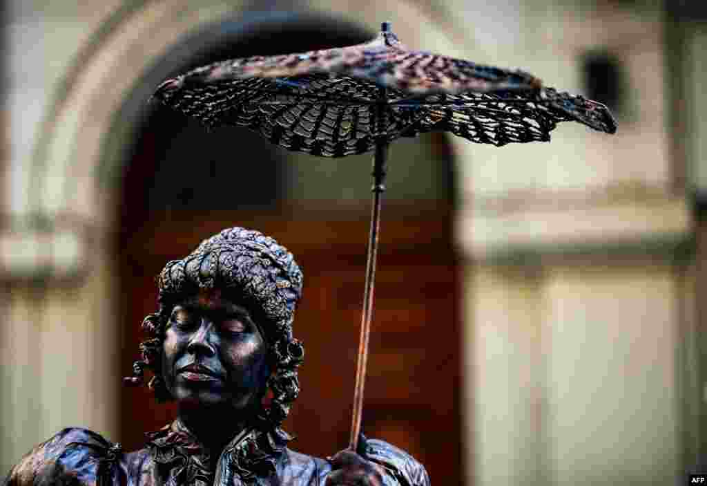 A performer takes part in the 20th National Contest of Living Statues in Buenos Aires, Sept. 22, 2019.