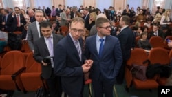 Jehovah's Witnesses wait for the decision in a courtroom in Moscow, Russia.