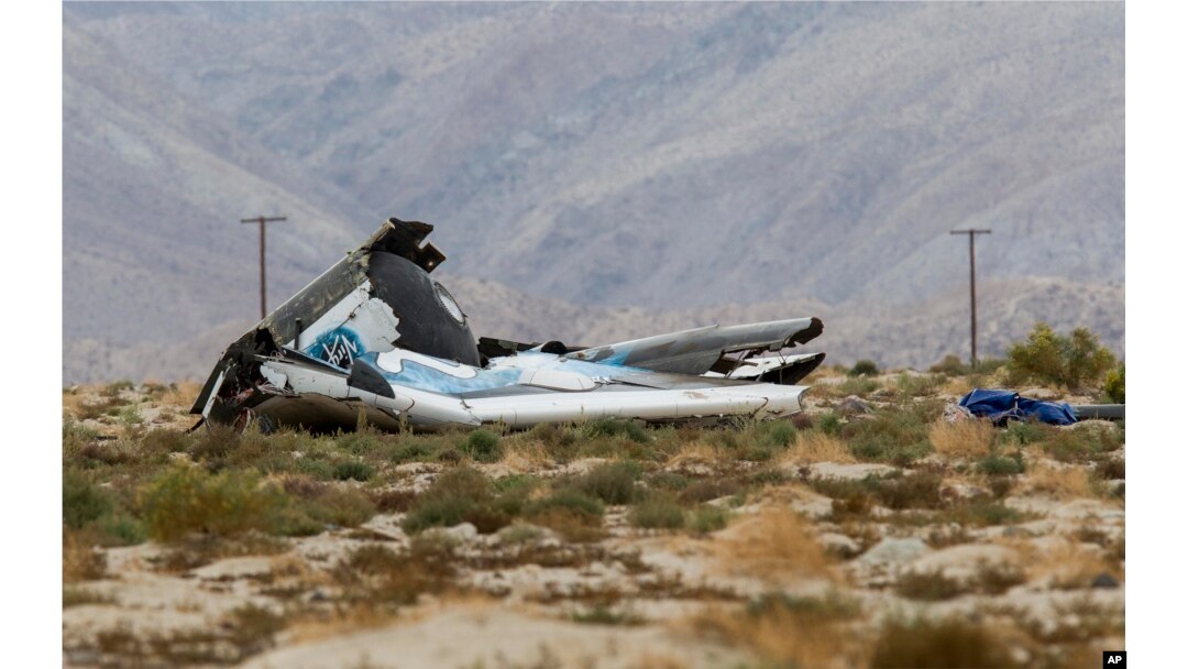 FILE - Wreckage lies near the site where a Virgin Galactic space tourism rocket, SpaceShipTwo, exploded and crashed in Mojave, Calif., Oct. 31, 2014.