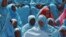 Women attend a ceremony marking Somalia's independence day in Mogadishu, July 1, 2012. 