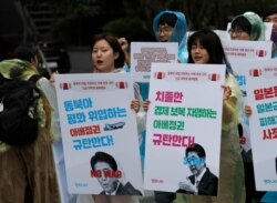 South Korean students shout slogans as they march to denounce Japanese government's decision near the Japanese embassy in Seoul, South Korea, July 10, 2019.