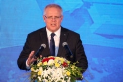 FILE - Australian Prime Minister Scott Morrison speaks during his visit to the Hanoi Formula One Grand Prix construction site in Vietnam, Aug. 23, 2019.