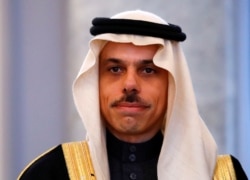 FILE - Prince Faisal bin Farhan Al Saud poses for the media in Berlin, Germany, March 27, 2019.