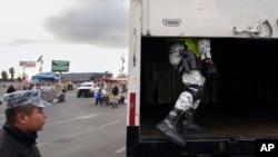 Members of Mexico's National Guard inspect a truck in line to cross the border into the United States from Mexico at the San Ysidro Port of Entry, in Tijuana, Mexico, Feb. 6, 2025.