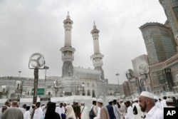 FILE - Muslim pilgrims make their way at the Grand Mosque in the Muslim holy city of Mecca, Saudi Arabia, Friday, Sept. 9, 2016.