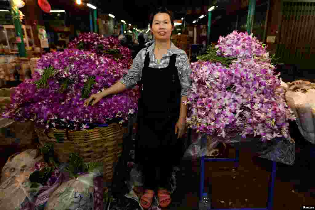 Ram, 46, poses for a photograph at her stall at the flower market in Bangkok, Thailand, Feb. 26, 2017. &quot;In this market men do the hard jobs, they carry heavy things, load trucks,&quot; said Ram.