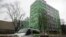 FILE - In this file photo taken Oct. 27, 2017, a car of Russian state-owned television station RT passes by the company's office in Moscow. 