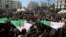 People take part in a protest demanding immediate political change in Algiers, Algeria, March 12, 2019.