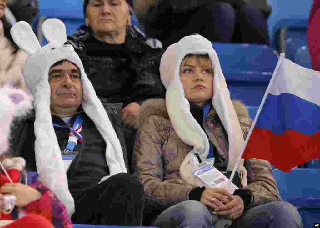 Spectators wait for the start of the figure skating competition at the Iceberg Skating Palace, in Sochi, Russia, Feb. 16, 2014.