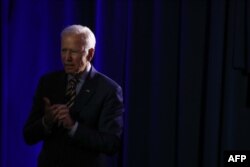 FILE - Democratic presidential candidate Joe Biden listens to a story from an attendee at the We Decide: Planned Parenthood Action Fund 2020 Election Forum to Focus on Abortion and Reproductive Rights event in Columbia, South Carolina, June, 22 2019.