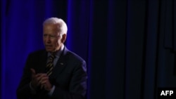 FILE - Democratic presidential candidate Joe Biden listens to a story from an attendee at the We Decide: Planned Parenthood Action Fund 2020 Election Forum to Focus on Abortion and Reproductive Rights event in Columbia, South Carolina, June, 22 2019.