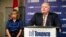 Toronto Mayor Rob Ford speaks at a news conference with his wife Renata (L) at City Hall, Nov. 14, 2013. 